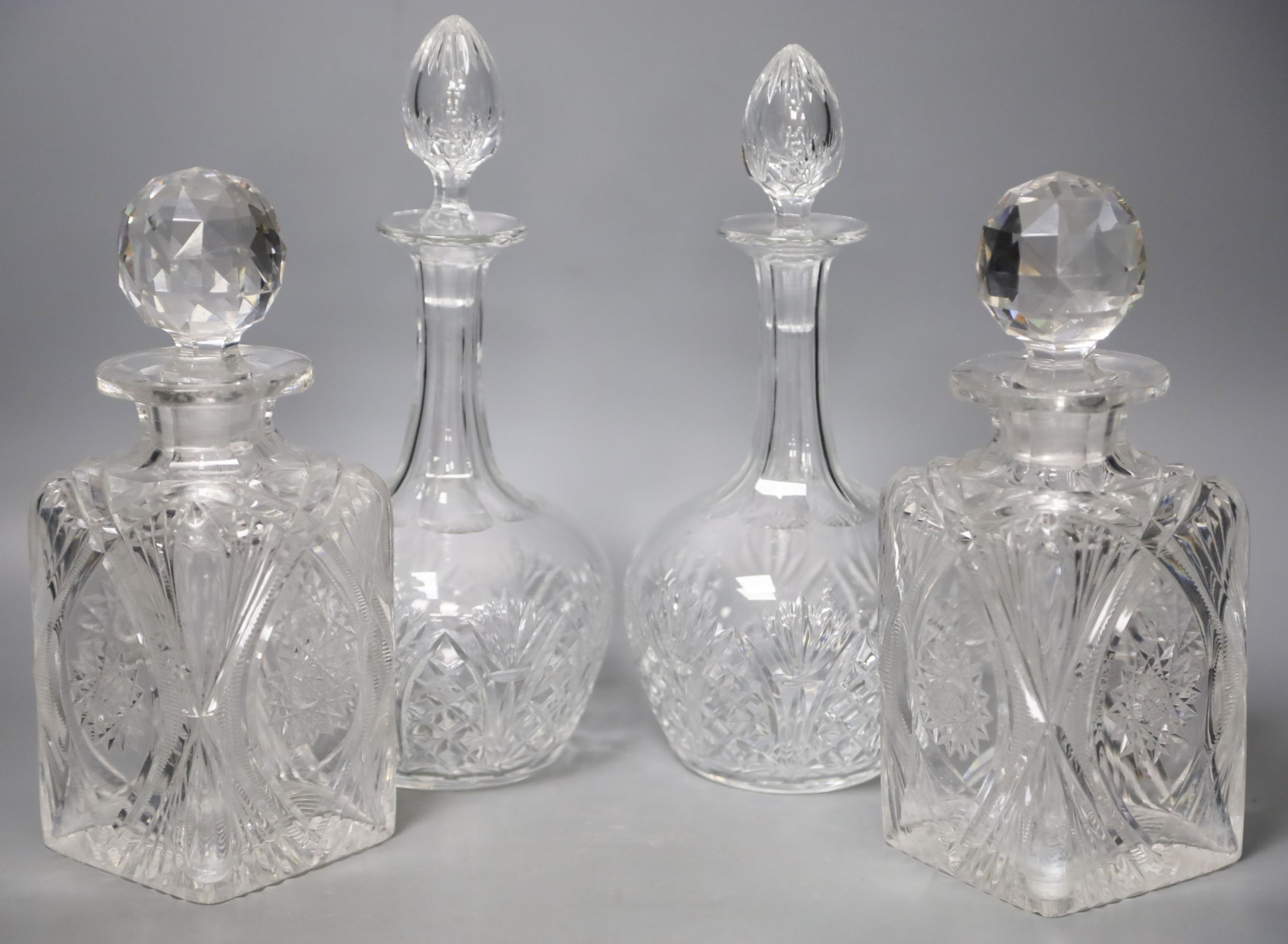 A pair of whisky case decanters and a pair of Victorian decanters 27cm